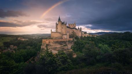 Enchanting Castle Under a Rainbow wallpaper