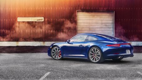 Sleek Porsche 911 Against a Textured Backdrop wallpaper
