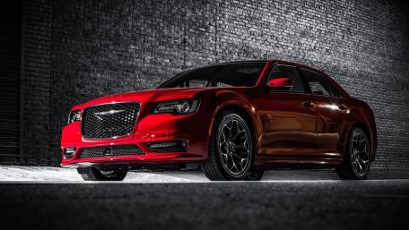 Sleek Red Chrysler 300 in Urban Setting wallpaper