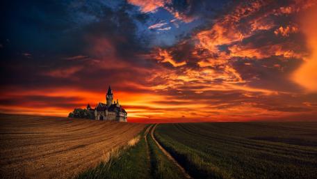 Majestic Castle Under a Fiery Sunset wallpaper