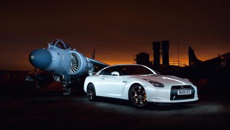 Dynamic Duel of Speed and Power wallpaper