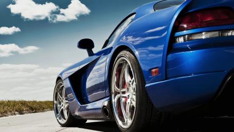 Sleek Blue Car on Open Road Landscape wallpaper