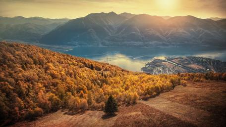 Majestic Autumn Landscape Overlooking a Serene Lake wallpaper