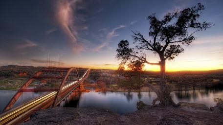 Serene Sunset Over the Bridge and Lake wallpaper