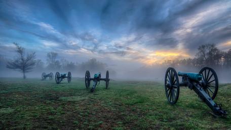 Historical Cannons in a Misty Landscape wallpaper