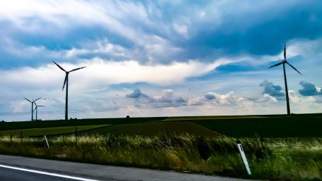 Ethereal Sky Over Wind Turbines in Austria wallpaper