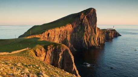 Majestic Cliffs Overlooking Tranquil Waters wallpaper