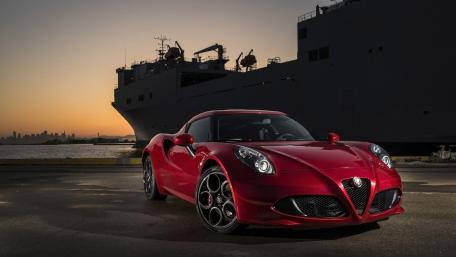 Sleek Car Against Majestic Sunset View wallpaper