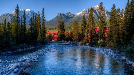 Mountain River Serenity in Nature's Embrace wallpaper