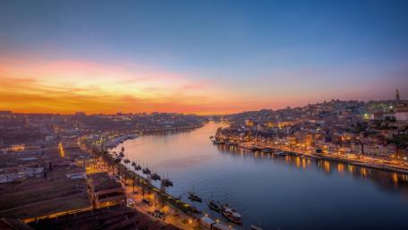 Serene Sunset Over a Vibrant Cityscape wallpaper