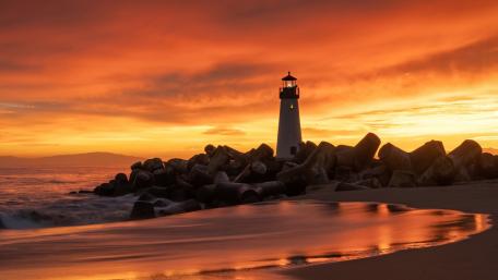 Majestic Lighthouse at Sunset Dreamscape wallpaper