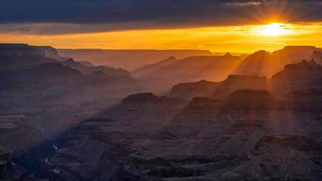 Majestic Sunset Over Mountain Valley wallpaper