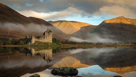 Lost Castle in Serene Mountainscape wallpaper