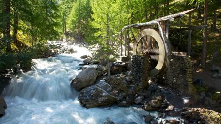 Serene Watermill by the Flowing Stream wallpaper