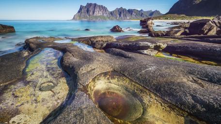 Serene Coastal Landscape with Majestic Mountains wallpaper