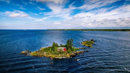 Serene Island Retreat Amidst Tranquil Waters wallpaper