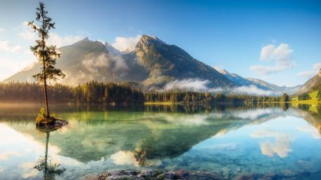 Serene Mountains Reflected in Tranquil Waters wallpaper