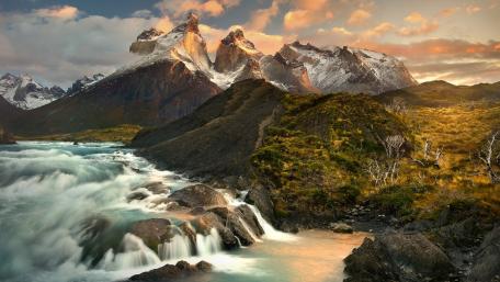 Majestic Mountains and Flowing River in Sunset Glow wallpaper