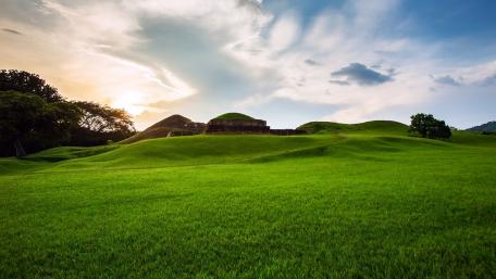 Serene Green Hills Under a Beautiful Sky wallpaper