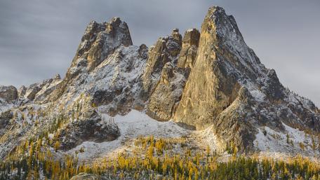 Majestic Mountain Peaks Under Dramatic Skies wallpaper