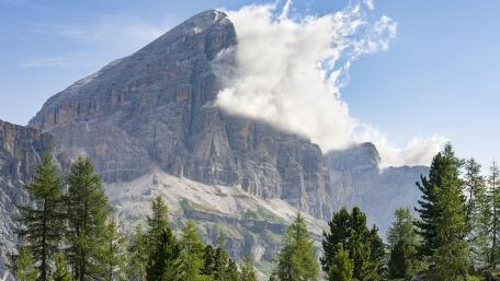 Majestic Mountain Clouds in a Serene Landscape wallpaper