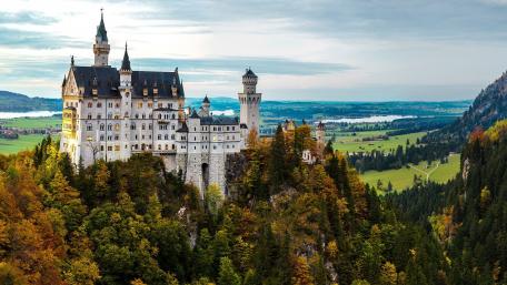 Majestic Castle Overlooking Serene Landscape wallpaper