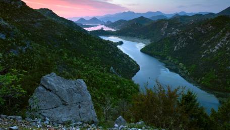 Serene River Valley at Dusk in Nature's Embrace wallpaper