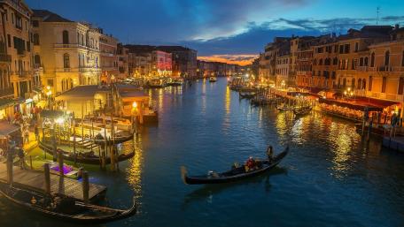 City Lights Reflecting on Water at Dusk wallpaper
