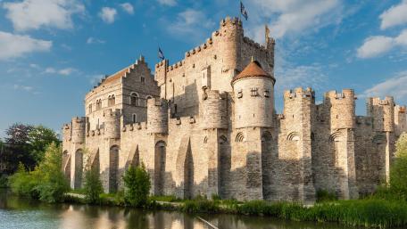 Majestic Castle Reflections in a City Landscape wallpaper