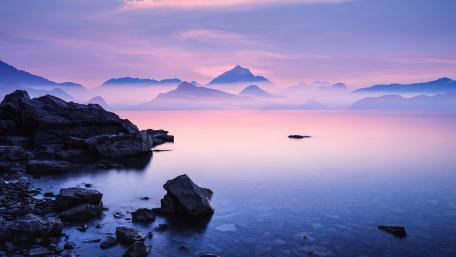 Serene Dawn Over Misty Mountains wallpaper