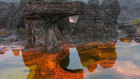 Majestic Rocky Landscape Reflected in Water wallpaper