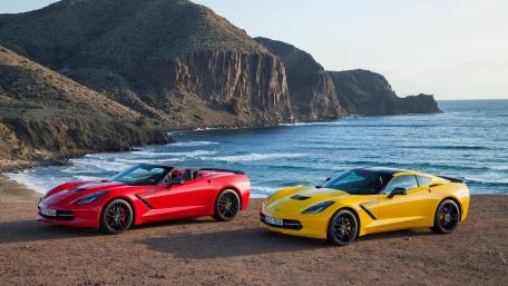 Vibrant Sports Cars by the Coastline wallpaper