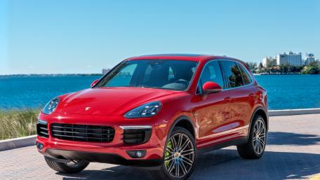 Sleek Red SUV by the Waterfront wallpaper