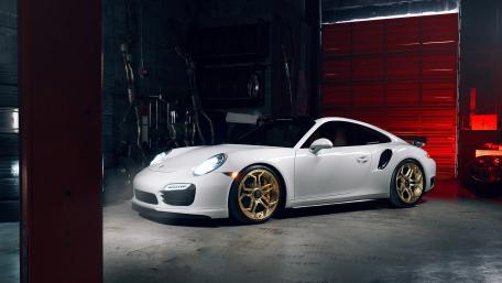 Sleek White Sports Car in an Industrial Setting wallpaper