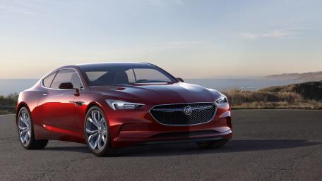 Sleek Red Luxury Car on Open Road wallpaper