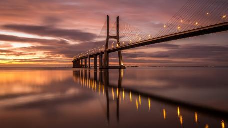 Stunning Bridge Under a Colorful Sunset Sky wallpaper