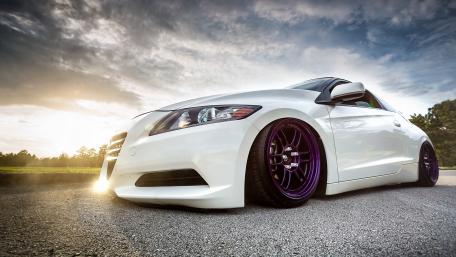 Sleek White Car with Stunning Sunset View wallpaper