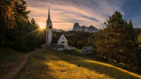 Tranquil Mountain Sunrise Landscape with Church wallpaper