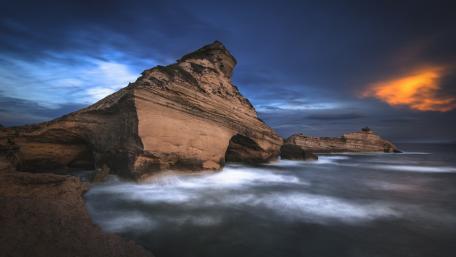 Majestic Coastal Cliffs Under a Dramatic Sky wallpaper