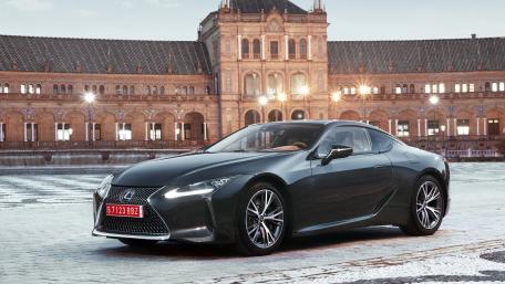 Sleek Luxury Sports Car in Urban Setting wallpaper