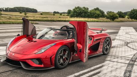 Sleek Red Supercar on the Runway wallpaper