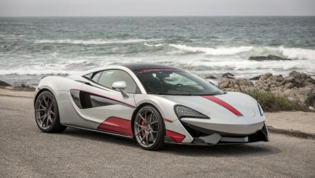 Sleek Silver Sports Car by the Ocean wallpaper