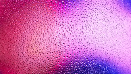 Vibrant Raindrop Symphony on Glass Shielding Colors wallpaper