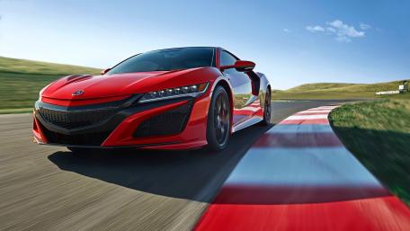 Sleek Red Sports Car on the Track wallpaper