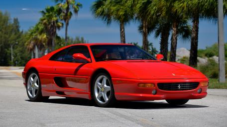 Stunning Red Ferrari Under Palm Trees wallpaper