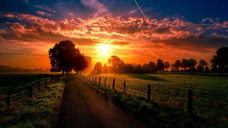 Serene Sunset Over Countryside Road wallpaper