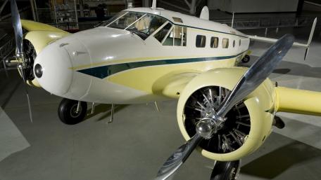 Vintage Airplane Showcase in a Museum wallpaper