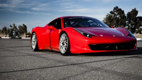 Sleek Red Sports Car Wallpaper Featuring Performance Driven Design wallpaper