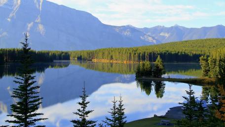 Serene Mountain Reflection Over Tranquil Lake wallpaper
