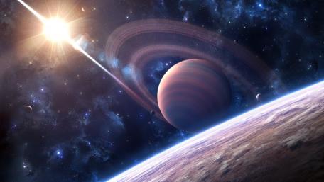 Majestic Ringed Planet in Cosmic Realm wallpaper